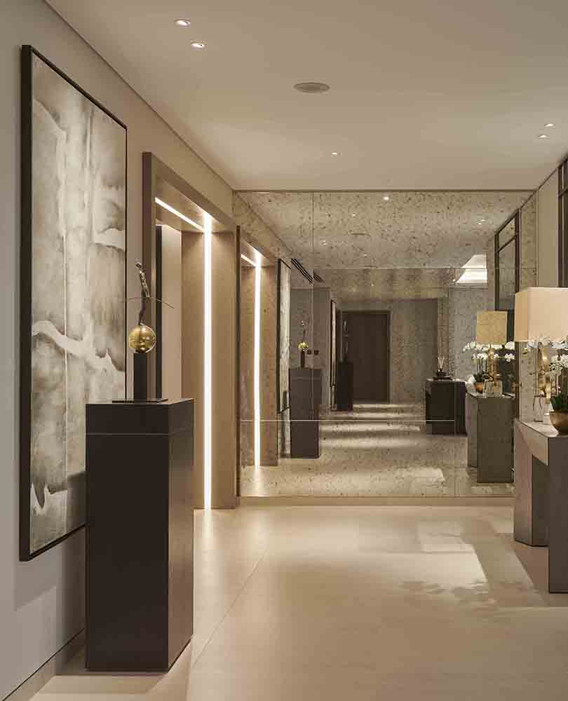 calm corridor with a combination of downlights and LED strip