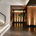 Uplights to textured wall by staircase