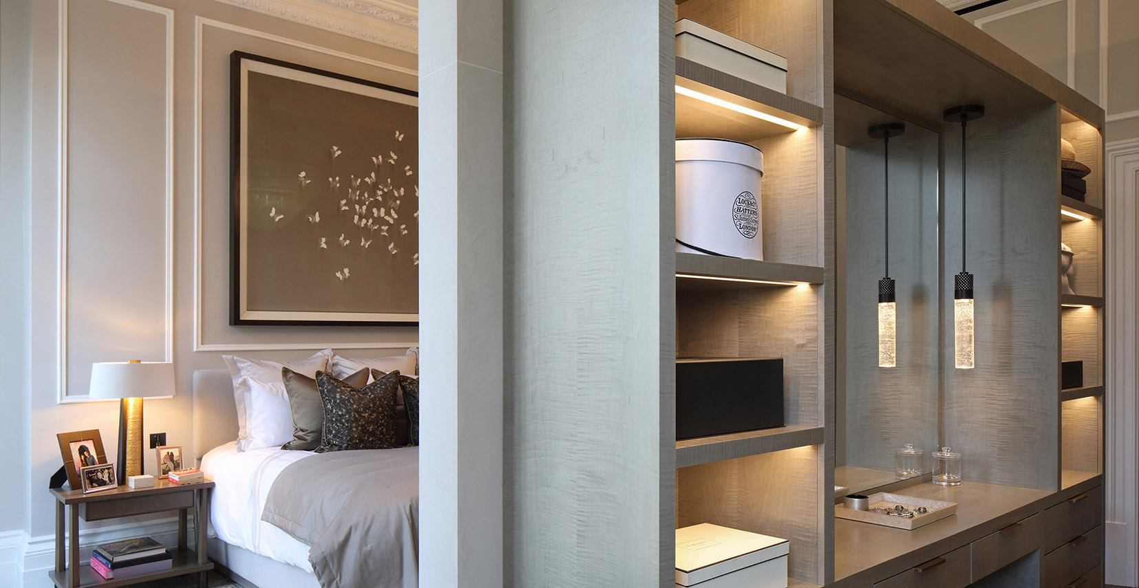 shelving behind bedroom with front lighting and hanging pendants