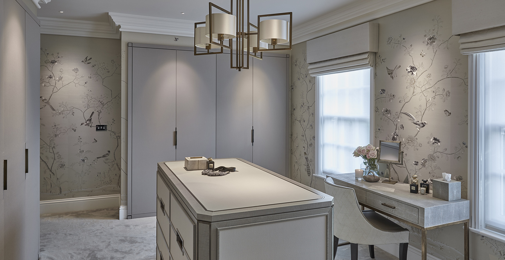 calming dressing room with central pendant and downlit wardrobes