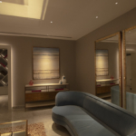 Living room with blue sofa, coffer ceiling and lit archway to hallway