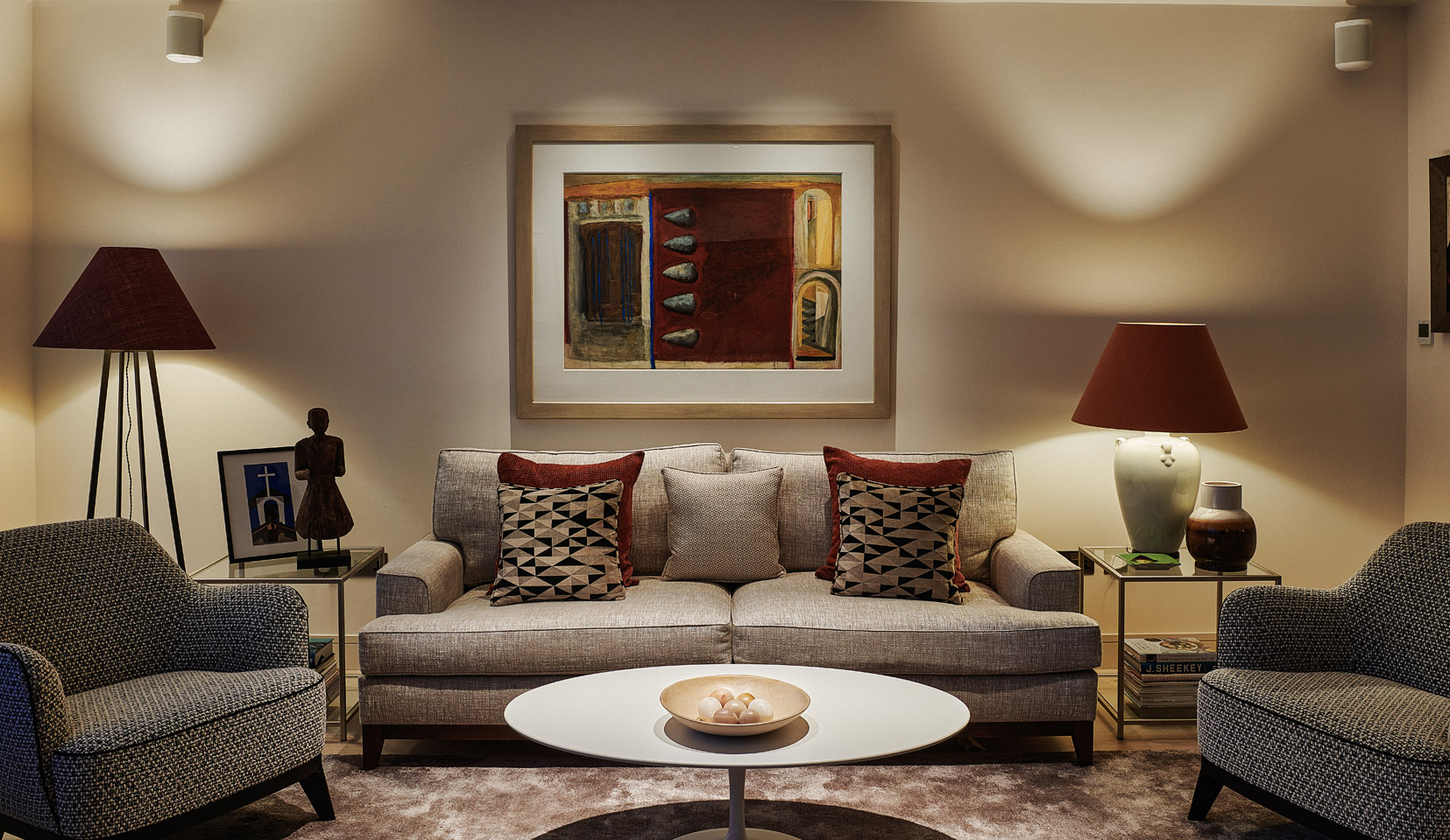 cosy living area with artwork and table lamps