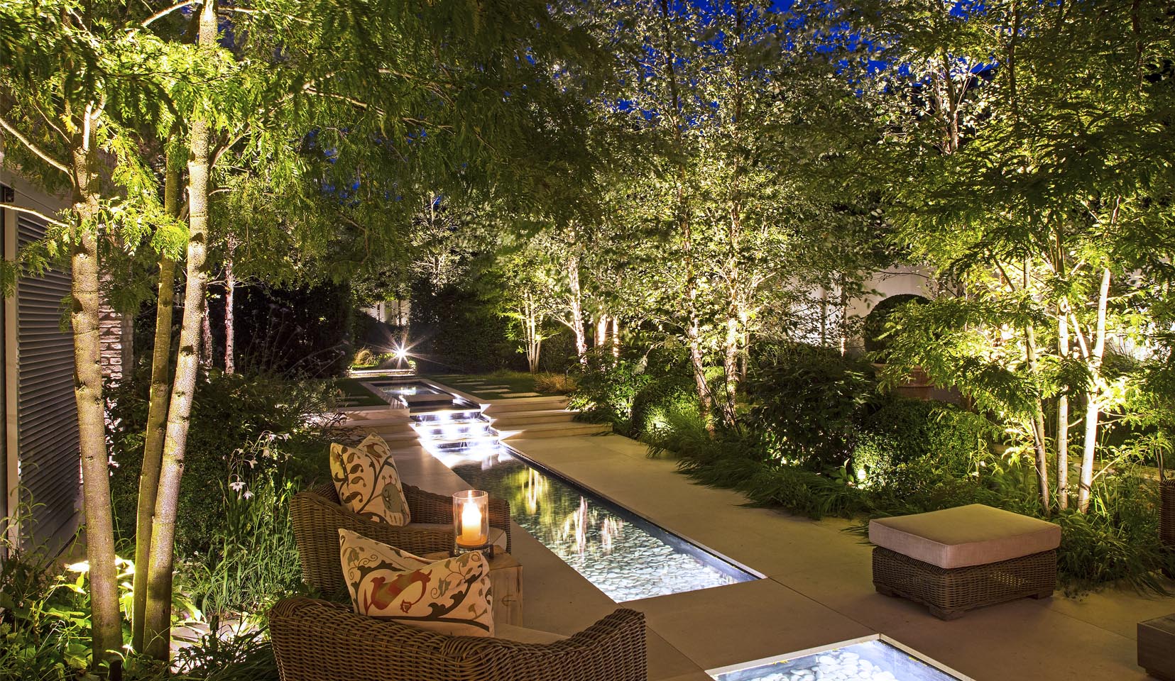 garden water feature lit with linear light
