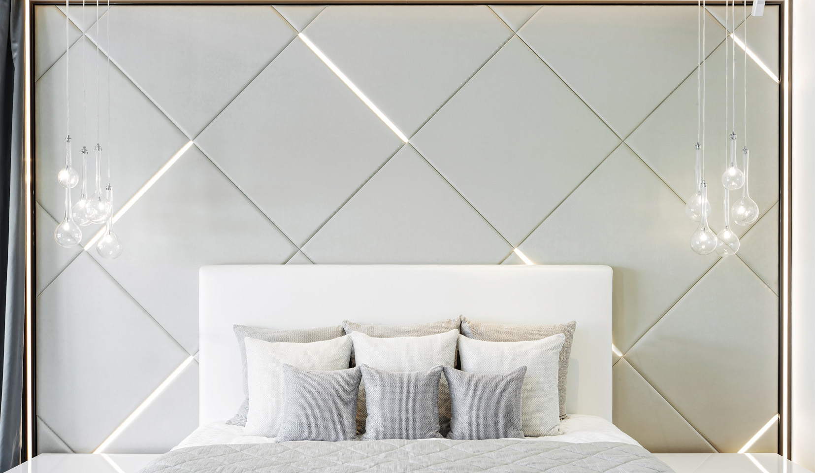 Bedroom with linear lit headboard