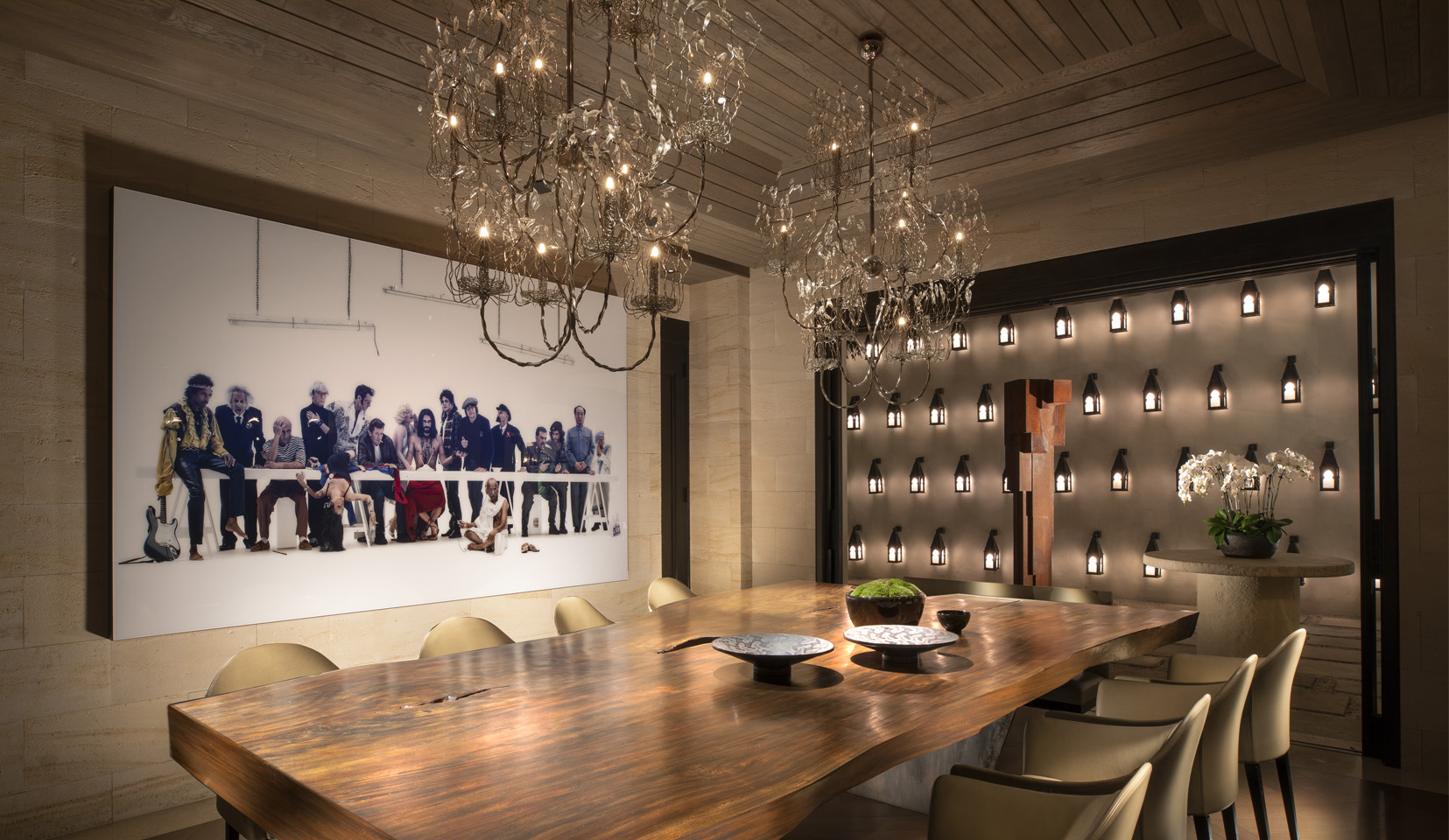 Dining room with chandelier over table and view out into courtyard