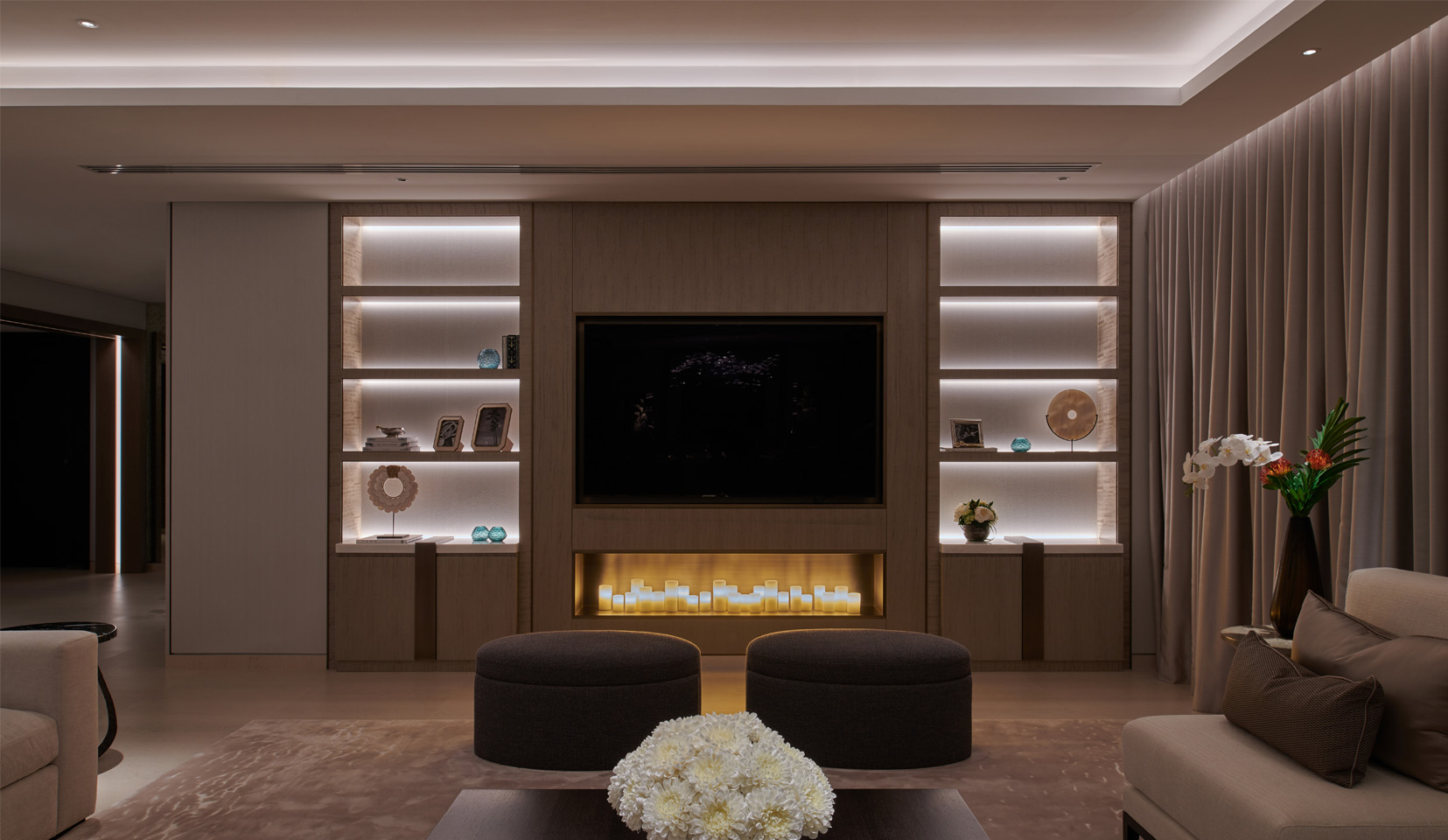 fireplace and TV with joinery unit either side