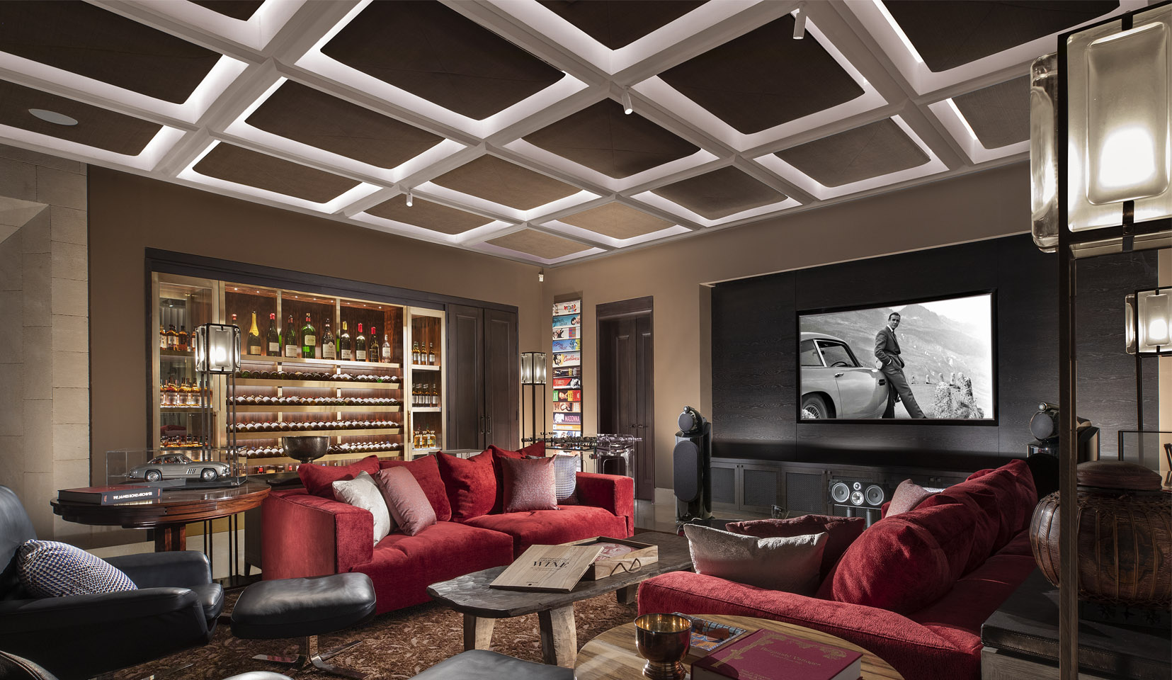 media room with spotlights from panelled ceiling onto seating area