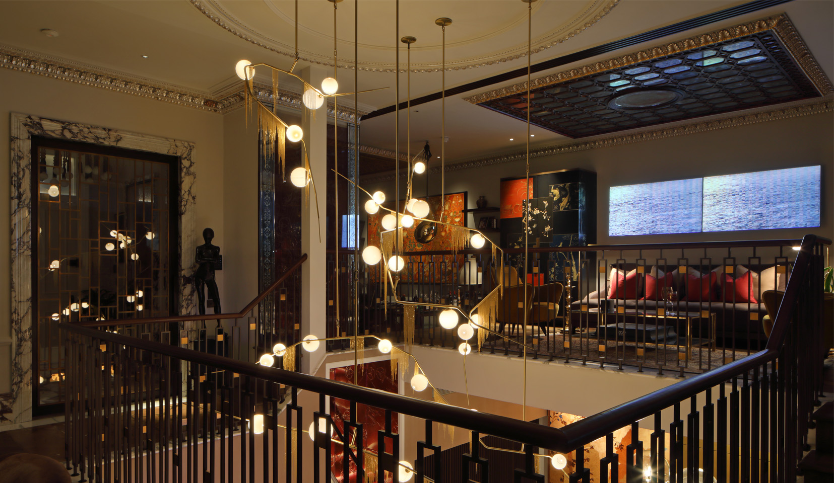 Decorative and architectural lighting combined between the floors