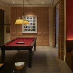 bar area and pool table in entertainment room