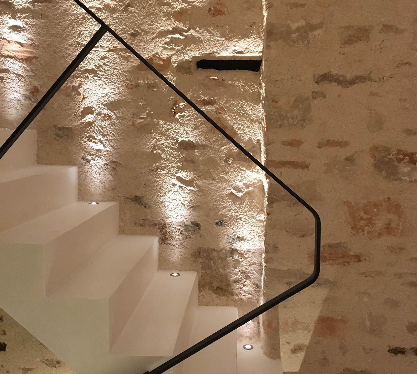 uplit textured wall on staircase