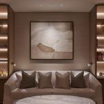 beautiful art lit between two shelving units