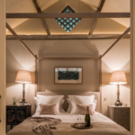 bedroom with uplit pitched ceiling