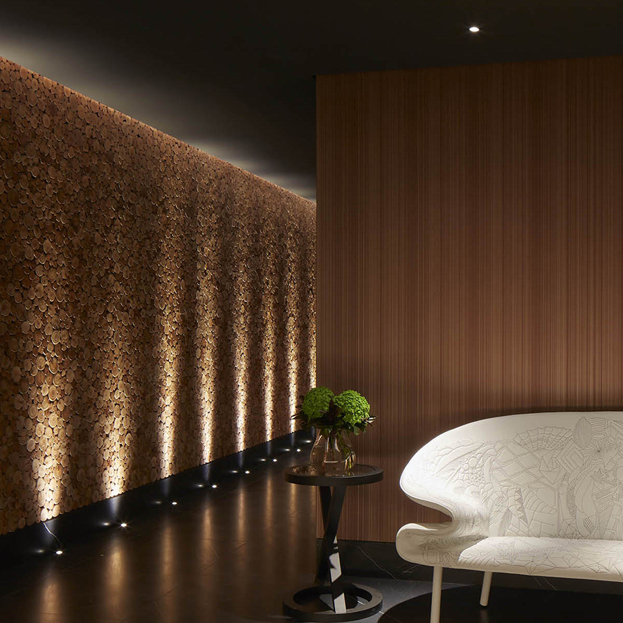uplit wall crating a dramatic corridor