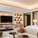 malakiya villas hotel bedroom with softly lit coffered ceiling and back lit shelving