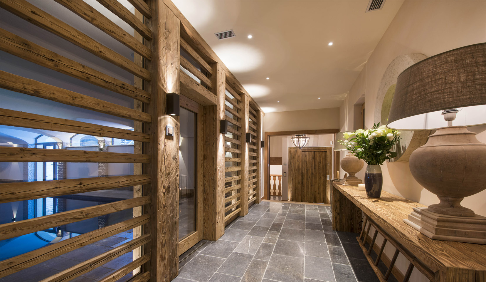 Wooden panelled hallway in chalet with downlights