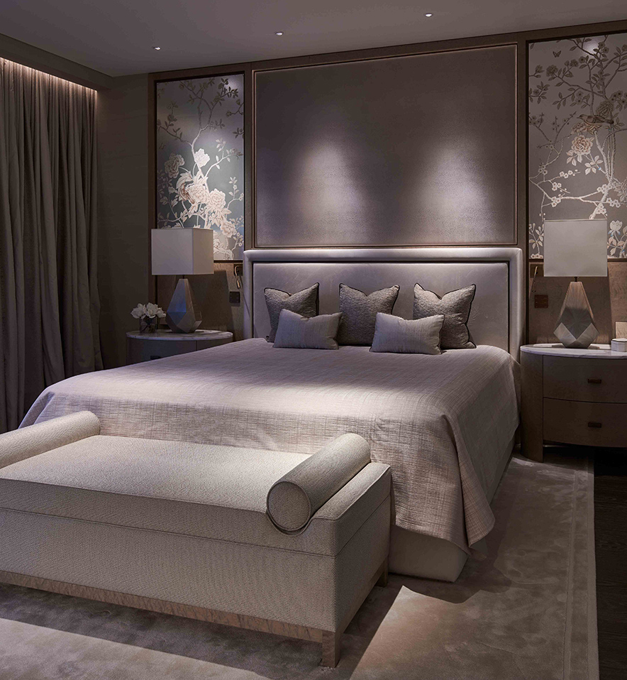 luxurious bedroom lighting with downlights to bedhead and on stool at bottom of the bed
