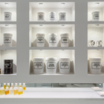 white bathroom shelves with apothecary jars with downlights