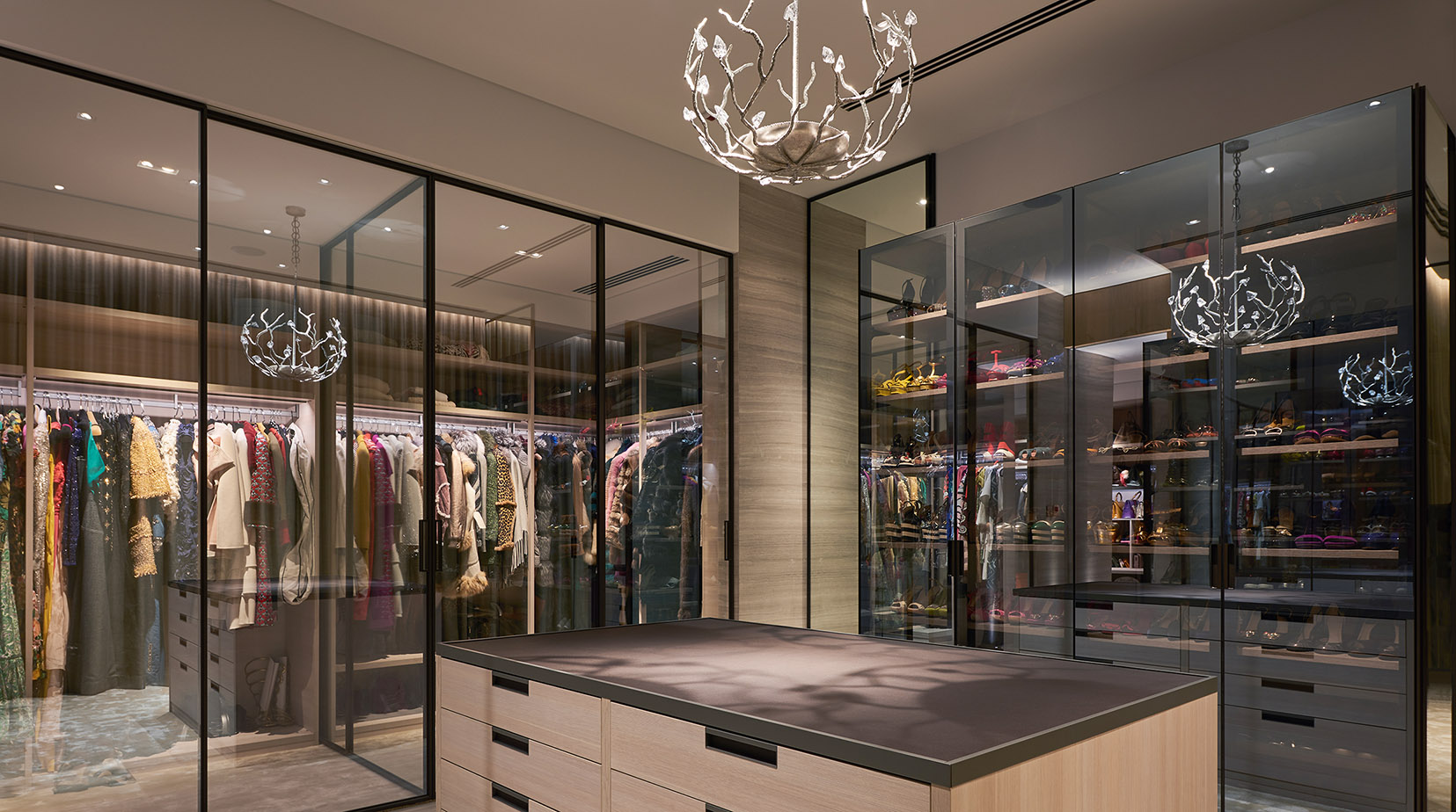 Central dressing area with pendant surrounded by open clothing racks
