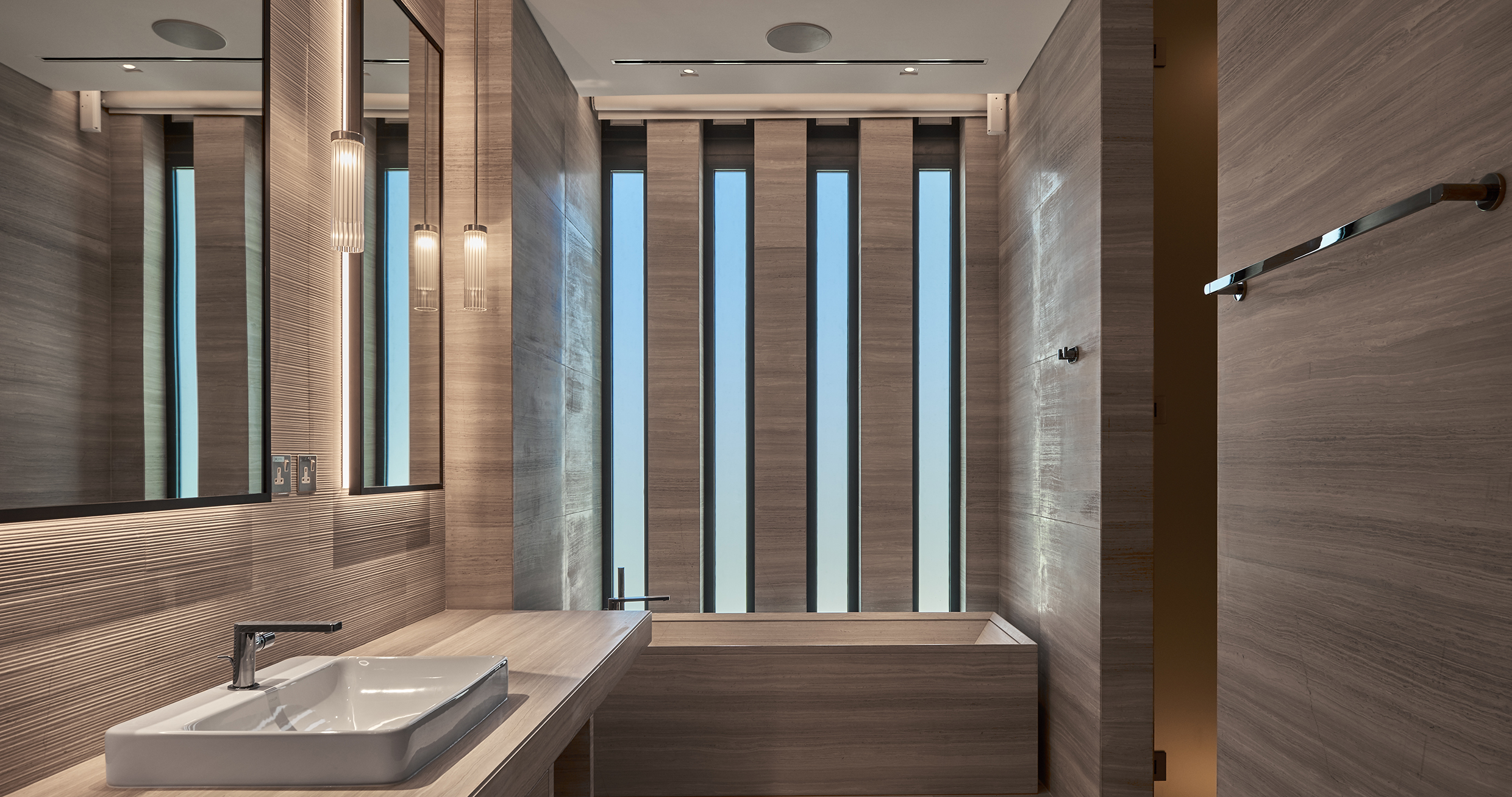 SLEEK STONE BATHROOM image