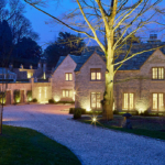 Driveway to country house with selective features lit