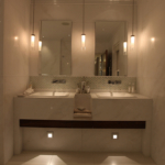 double basin with hanging pendants and low level lighting