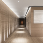 Dramatic long entrance hall with strong lighting design