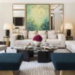 Luxury hotel suite living room with back lit shelving