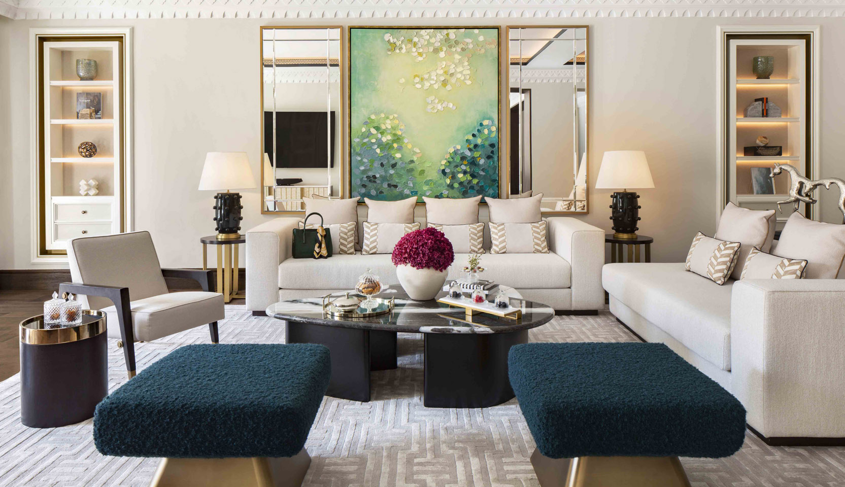 Luxury hotel suite living room with back lit shelving