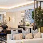 Dining area lighting within coffered ceiling with luxury interiors of this resort hotel