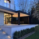 contemporary exterior with step lights and uplit tree