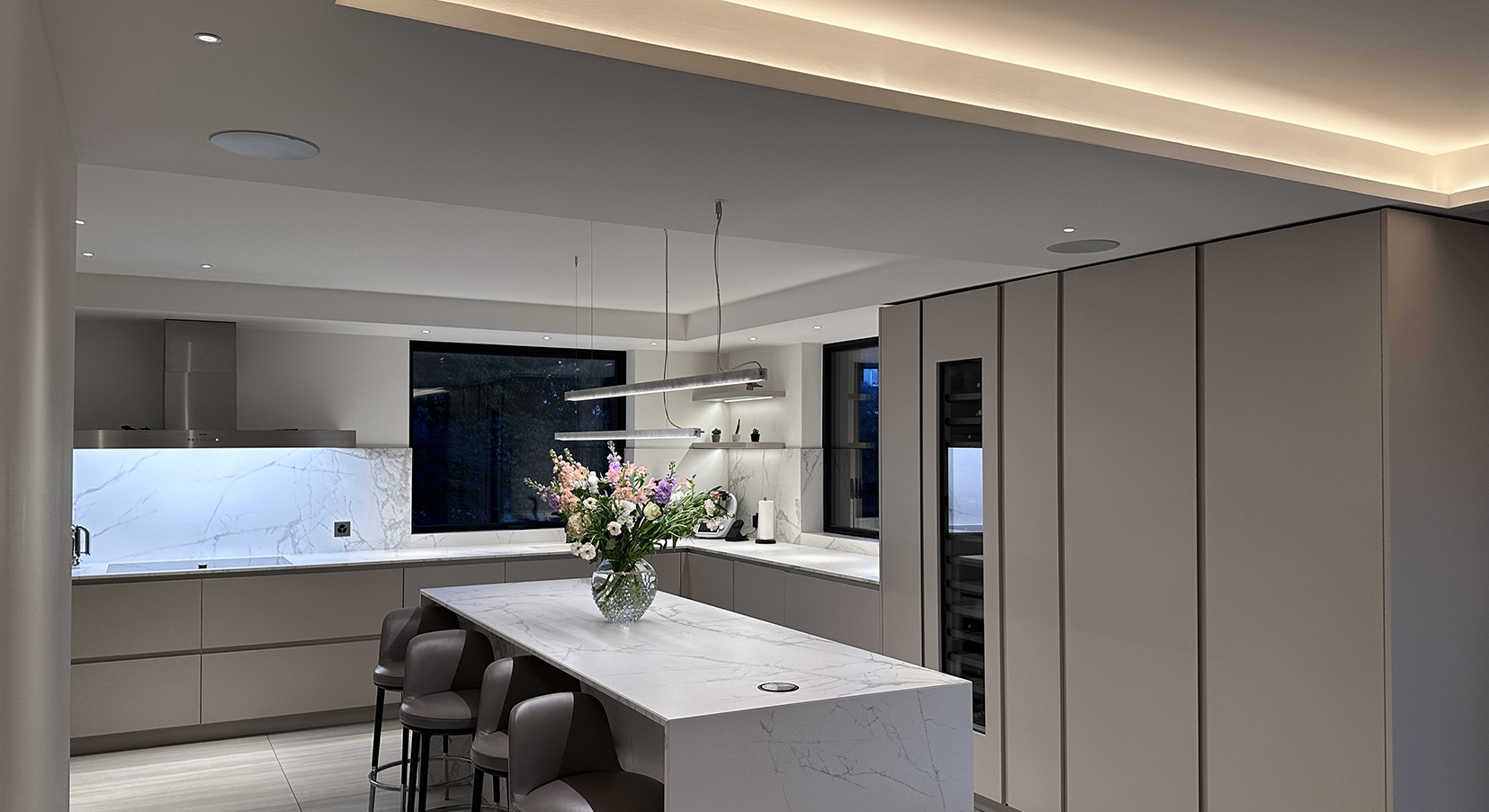 kitchen with long pendant over island and light in coffer